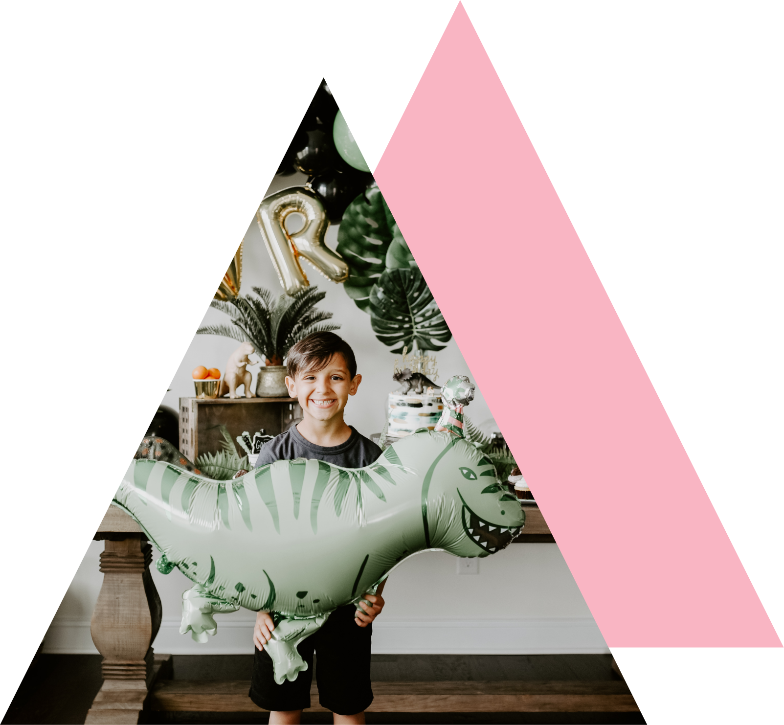 Boy holding dinosaur balloon